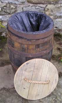 wooden barrel waste bin with lid off